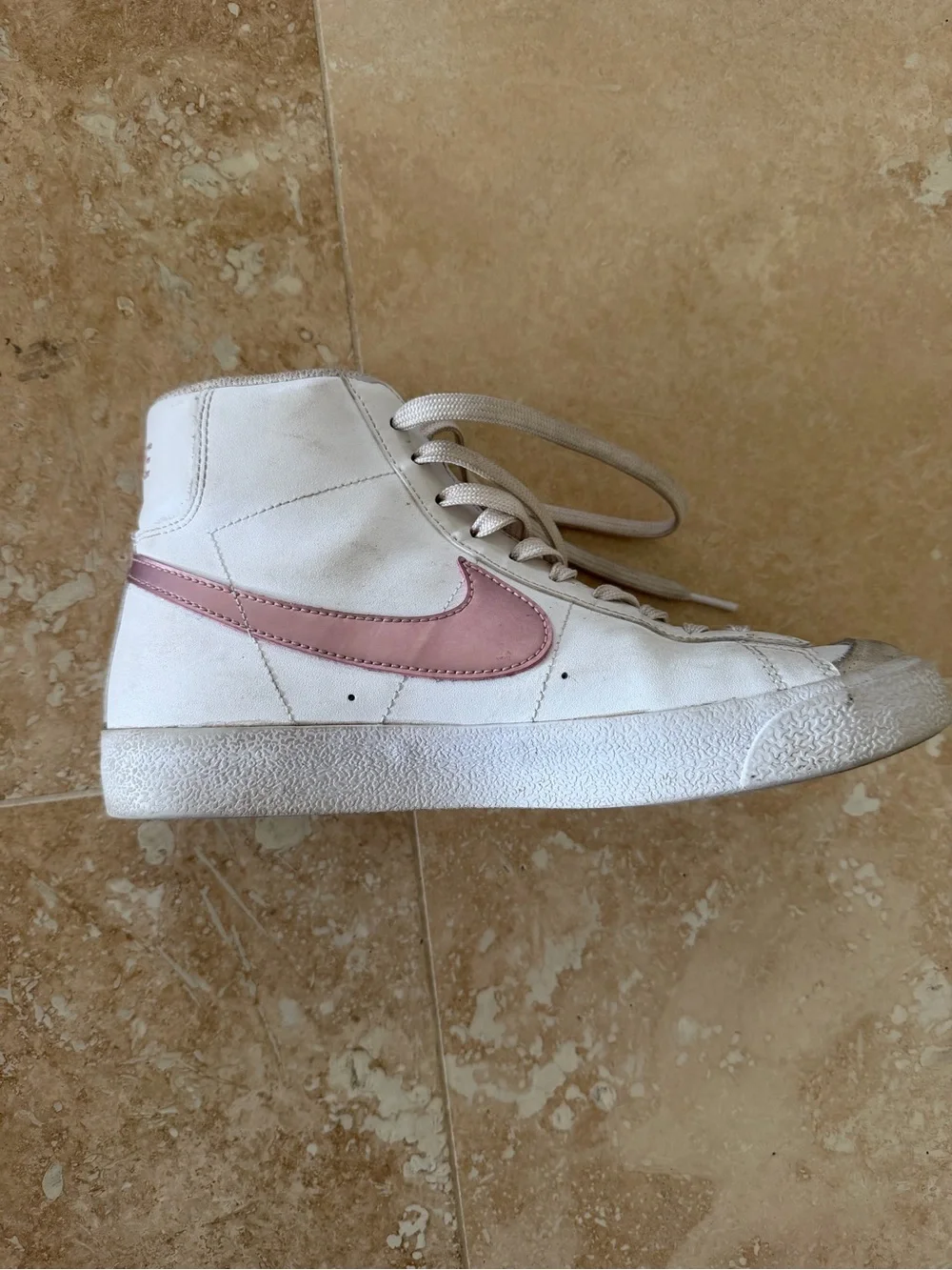 Nike Women’s White High-Top Sneakers with Pink Swoosh Accent